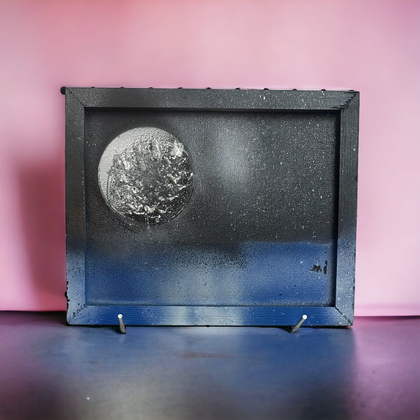 framed canvas picture of moon over sea at night